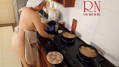 naturist housewife Regina Noir cooks at the kitchen. nude maid. bare housewife. s3
